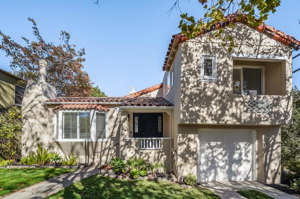 Charming updated Spanish style 4 bedroom 3 bath home in Millbrae's Highlands on a lovely tree lined street. Great room includes corner fireplace, front bay window, plantation shutters, spacious dining area and updated kitchen with island featuring retractable breakfast bar as well as bay window facing the backyard. Spacious primary suite with private balcony includes bright bathroom w/curbless shower, double vanity and ADA compliant features. Upstairs has two bedrooms (one with covered deck) that share hall bath with tub and stall shower. Lower level includes family room currently shown as guest suite with stall shower and separate entrance. Lush backyard includes large deck, mature fruit trees and raised vegetable boxes. Two separate garages (one attached and one detached). Partial basement provides area for wine storage. Laundry with sink in garage. Hardwood floors & spacious rooms throughout. Newly painted exterior as well as most of interior. Convenient to BART & Caltrain