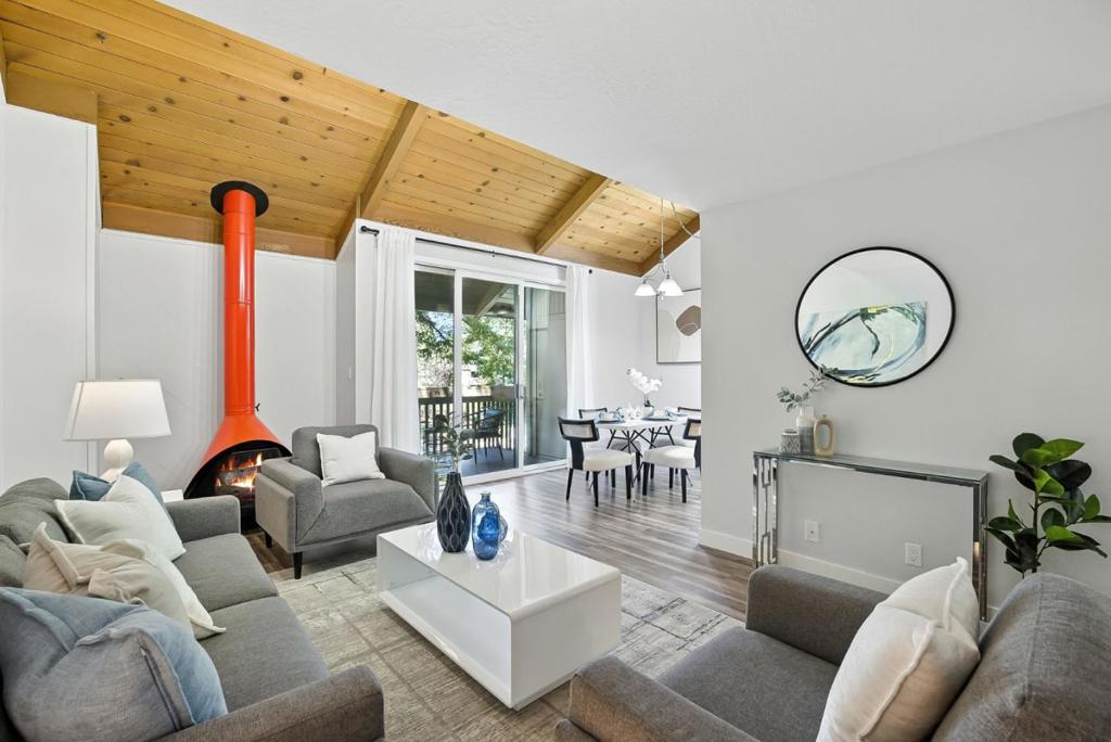 Discover the ideal combination of a peaceful retreat and proximity to a vibrant downtown in the heart of Mountain View. This beautifully updated top-floor one-bedroom, one-bathroom condo offers approximately 784 square feet of stylish living. The open living area, anchored by a classic fireplace and enhanced by soaring high ceilings, flows out to a private balcony with relaxing pool views. The modern kitchen is a delight with quartz countertops and abundant storage, and a large pantry. The oversized bedroom provides a peaceful retreat, while the updated bathroom showcases sleek finishes with a large vanity. The Cypress Point Lakes community is an oasis. Stay active with two swimming pools, a fitness center, and tennis courts, or unwind in the community spa. With multiple on-site laundry rooms, lush grounds, and an included covered parking space, every convenience is considered. Just minutes away from MV Caltrain station, and major tech hubs like Google, Meta, and Apple, making your commute effortless. This is a rare opportunity to own a peaceful home with direct access to Silicon Valleys best dining and transportation hubs.