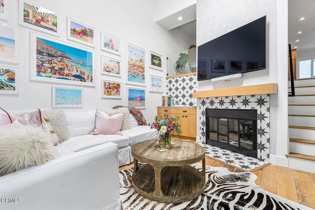 Discover this beautifully remodeled, split-level townhouse in the desirable Manhattan Village community. The current owner, only the second to live in the home, meticulously renovated the space in 2020. As a Plan 2 unit with permitted modifications, an interior wall was removed to create an open-concept living area. The custom white oak millwork and open shelving create a sleek, modern aesthetic throughout the home. The kitchen is a chef's dream, centered around a large island and featuring a Monogram refrigerator and Kitchen Aid range, warming drawer, and dishwasher all surrounded by stunning tilework. Striking statement light fixtures illuminate the space, highlighting the thoughtful design choices. The primary bedroom is a private retreat with a double vanity, a walk-in closet and a spacious shower. With two bedrooms and two and a half baths, the home offers both comfort and convenience. Enjoy the outdoors from your private patio or one of two balconies, perfect for relaxing or entertaining. The windows and sliding doors were replaced in 2022 with ground level windows upgraded to be shatter-proof and the property is equipped with an alarm for added peace of mind, offering a perfect blend of style, function, safety and security. 24/7 guard gated community with pool, play ground, pathways, close to restaurants, shopping, Westdrift Golf Course, Manhattan Beach Country Club and access to the Manhattan Beach Village Mall.