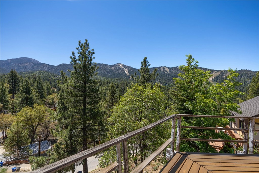 Charming A-Frame with Iconic Views + Investment Upside! Nestled in Moonridge Estates, this charming 2BD/1BA + loft A-frame is the smallest home in one of Big Bear’s most sought-after neighborhoods, offering massive value-add upside. Enjoy iconic 180° Bear Mountain views, a generous lot with expansion potential, and Big Beautiful Bill tax incentives for developers and investors. With year-round tourism, high STR demand, and comps supporting significant renovation returns, this is a rare chance to own in exclusive Moonridge Estates at an entry-level price point. Fix, expand, or short term lease the cabin is your gateway to strong long-term ROI in Big Bear’s booming investment market. Steps to Bear Mountian snow sporting, golf, zoo, trails & more!