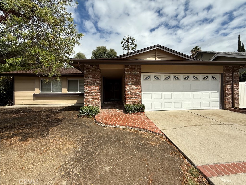 THIS GORGEOUS SINGLE-STORY HOME IS CENTRALLY LOCATED IN NORTHRIDGE, SURROUNDED BY MANY AWARD-WINNING SCHOOLS. DOUBLE DOORS OPEN TO AN INVITING ENTRYWAY WITH NEW VINYL PLANK FLOORING. THE OPEN LAYOUT IS HIGHLIGHTED BY CATHEDRAL CEILINGS, A FLOOR-TO-CEILING FIREPLACE AND SLIDING GLASS DOORS. THE ADJACENT DINING ROOM OVERLOOKS THE BACKYARD THROUGH EXPANSIVE WINDOWS, FILLING THE SPACE WITH NATURAL LIGHT. THE MODERN KITCHEN FEATURES RECESSED LIGHTING AND GRANITE COUNTERTOPS. A VERSATILE DEN WITH RECESSED LIGHTING CAN SERVE AS AN OFFICE OR A FOURTH BEDROOM. THE MASTER SUITE FEATURES SLIDING DOORS, A BATHROOM AND CLOSETS. TWO ADDITIONAL BEDROOMS SHARE A WELL-APPOINTED HALLWAY BATHROOM. AN ATTACHED 2-CAR GARAGE PROVIDES DIRECT ACCESS TO THE HOME. CONVENIENTLY LOCATED NEAR DINING, SHOPPING, SCHOOLS, CSUN, AND MAJOR FREEWAYS, THIS HOME OFFERS BOTH COMFORT AND ACCESSIBILITY