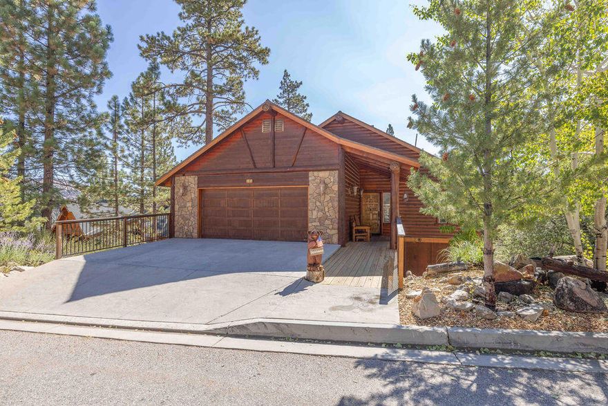 Beautiful Log-Style Mountain Home in prime Castle Glen Big Bear location! This well-maintained 3 bed, 3 bath home + bonus room is located on a cul-de-sac with low traffic. Vaulted tongue-and-groove ceilings and an open floor plan create a warm, spacious feel. The main level features the living room, spacious kitchen with granite countertops and knotty alder cabinetry, an oversized 3/4 bath, and bonus room that can serve as a 4th bedroom or office. Updated luxury vinyl wood like flooring upstairs and in hallways and baths downstairs; bedrooms are carpeted. En suite primary bedroom includes a fireplace, huge walk-in closet, jacuzzi soaking tub & separate shower. All bedrooms have sliding glass doors to the lower rear deck. Enjoy outdoor living with covered front porch and rear decks on both levels. Efficient vinyl dual-pane windows throughout. Attached 2-car garage. Never used as a rental--pride of ownership throughout. Centrally located near Big Bear Lake, Bear Mountain ski slopes, Golf, Big Bear Zoo, the village, dining & more!