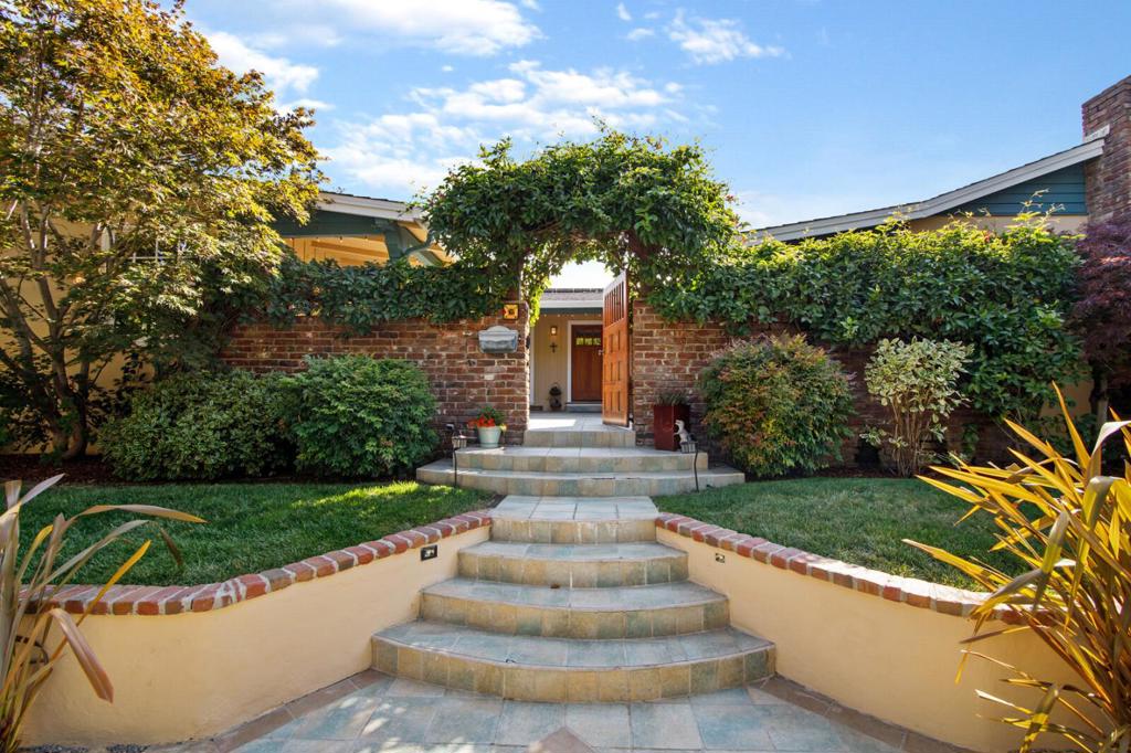 Beautiful Mt. Carmel home surrounded by mature foliage and amazing architectural detail. Open the gate to a serene and ample courtyard that serves as an outside living and gathering place, while keeping the home safely set back from the street. The kitchen is open and rich in the craftsman character found throughout the Mt. Carmel neighborhood. Gleaming hardwood floors throughout the home. Large windows surround the courtyard and fill the home with natural sunlight. The large living room is open to the dining room with an elegant fireplace that serves as not only the focal point of the room, but a warm place to gather in the winter months. The large master bedroom offers plenty of space, hardwood floors, and a large master bathroom. 3 more bedrooms all along the sun-lit hallway that runs the length of the courtyard. The backyard is a majestic wonder with fruit trees and patio space for guests or outdoor activity. The large 2 car garage is perfect for vehicles, gym/workshop. 1 min 280
