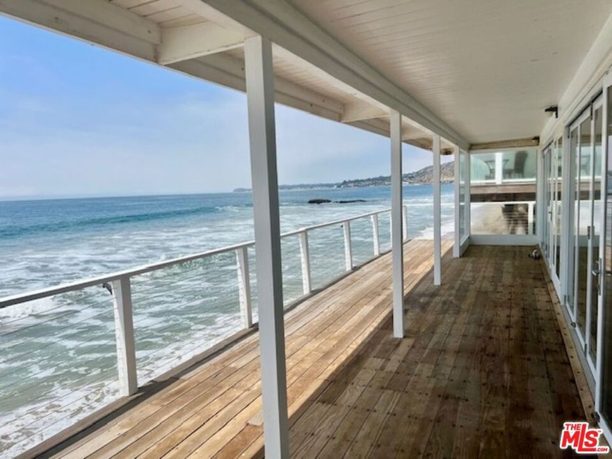 Malibu Road Spacious and gorgeous beachfront 3 BR /3BA is updated with all new surfaces including hardwood floors throughout, new appliances and private washer/dryer. This light and bright 3 bedroom 3 has Direct Beach stair access, large wrap around deck with folding glass doors, private courtyard patio and 2 car garage with 2 addition parking spaces. The best price on the beach, a must  see. A additional 1br. 1ba. is also available that could make this a 4br. 4ba.  1 year Lease minimum. Pets negotiable. Call for appointment, easy to show.