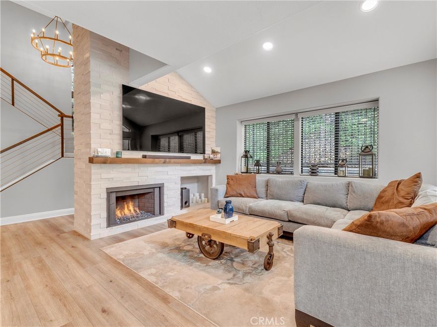 Step into a home where industrial edge meets modern elegance - welcome to your fully renovated, move-in-ready townhouse in the heart of Agoura Hills. This stunning 3-bedroom, 3-bath residence spans 1,629 square feet and features over $145,000 in upgrades completed in the last two years, offering a lifestyle that’s as stylish as it is effortless. Almost every inch of this home has been meticulously transformed. Brand-new flooring flows seamlessly throughout, complemented by a striking floor-to-ceiling stacked stone fireplace wall that anchors the open living space with dramatic flair. The kitchen is a chef’s dream - reimagined with sleek cabinetry, stainless appliances, and modern finishes that make both everyday meals and entertaining a delight. Each bathroom has been luxuriously updated, featuring designer touches for a spa-like experience.

Fresh paint and all-new light fixtures brighten every room, while custom barn doors add a touch of industrial character and privacy where you need it most. The upgraded electrical panel ensures peace of mind and supports all your modern living needs. Nestled in a sought-after Agoura Hills neighborhood, you’re just moments from top-rated schools, vibrant dining, boutique shopping, and convenient public transportation. Imagine morning strolls to nearby parks, afternoons exploring local cafes, and evenings unwinding in your beautifully curated home.
