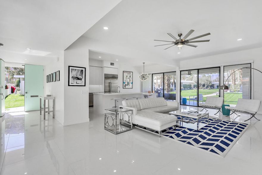 ( *Booked JAN 2026* ) Owner uses March April each year. Original William Krisel renovated to mid-century modern open concept. This sleek light & bright 3-bedroom, 3-bath condominium offers contemporary aesthetics throughout. Near the world renowned Indian Wells Tennis Gardens. Gourmet kitchen featuring Sub Zero fridge  + Wolf gas range. Custom gas fireplace and 82-inch smart tv in the living room. 2129sf open floor plan. The walls of glass remain as a signature mark of the original mid-century modern design. 65-inch tv & king bed in both the main bedroom suite and in the second bedroom. 2-full beds in third bedroom. Wi-fi. 125 tv channels, terrazzo tile, no carpet. Instant hot water throughout. Full-size washer & dryer. Firepit, fountain & dining table in the private center courtyard. Mountain views,, lush manicured landscape, pool with shuffleboard area. Weber BBQ. 2-car garage is mere steps to the front door. Guest parking. 24-hour manned gate & roving patrol. Indian Wells CC is a member of the INVITED family of clubs (formerly Clubcorp). No memberships are included. Mail is delivered to your door. Utilities included with $200 monthly rate cap. Concierge trash service means you never have to worry about which day is trash day. (*Booked May- October 2024*) (*Booked Jan- Feb 2025*)