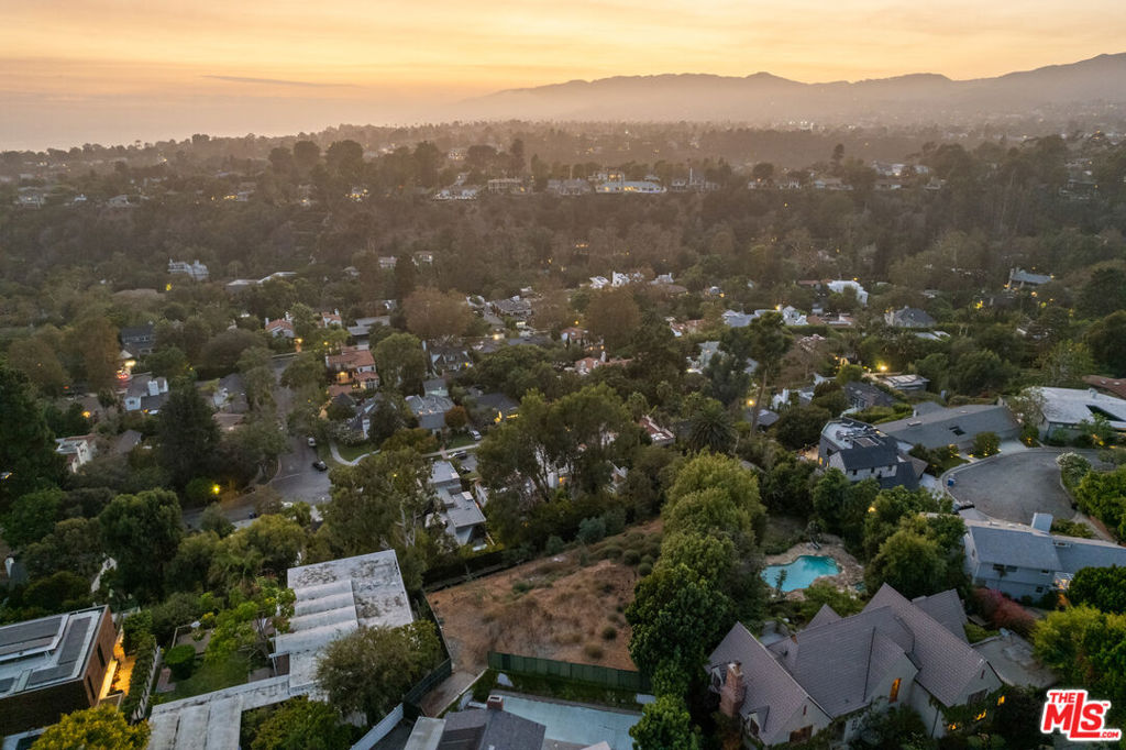 Incredible fully-approved ocean view development opportunity on one of Santa Monica's most coveted streets, north of San Vicente. Located at the end of a small Cul-De-Sac with a long private driveway that leads one to a truly rare and special development site that offers privacy, surrounded by lush tree tops, and head-on dramatic ocean views. Although the North of Montana is not usually known for great views, this is one of the few streets and select properties that offer direct, uninterrupted ocean views, along with lush greenery throughout. Included in the sale are the fully approved plans which have been paid for, and issued, for an approx. 10,011 sqft home designed by the highly acclaimed architectural firm - Vantage. The design is for a truly spectacular modern, architectural home filled with walls of glass looking straight to the ocean. Other amenities in the plans include 5 full bedrooms, a generous size home gym, an impressive office, a large entertainment/media room, an infinity edge pool looking straight to the views, plus more. Truly a unique opportunity on a rare development site in Santa Monica.
