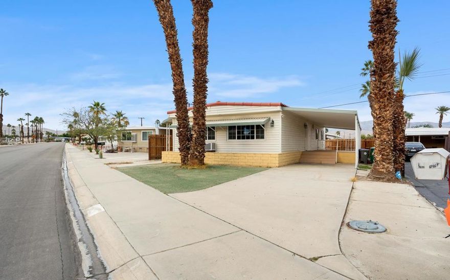 PRICED TO SELL AND READY TO MOVE IN! This beautifully remodeled manufactured home is located in the highly desirable Tri-Palms Estates 55+ community where you own the land and this one has one of the lowest HOA fees in the entire community. The property has been completely renovated from top to bottom, featuring brand-new windows, new flooring throughout, fresh interior and exterior paint, central A/C and heating, and new appliances including stove, refrigerator, and microwave. The spectacular, fully remodeled bathrooms truly stand out with modern finishes and a high-end feel, elevating the home's overall appeal. Ideally situated with quick access to the I-10 freeway and just minutes from major shopping and dining such as Walmart, Home Depot, Costco, and Sam's Club, plus convenient access to the entire Coachella Valley within 20 minutes. Located in IID electric territory for lower utility costs, residents also enjoy free golf and resort-style amenities including pools and spas, lighted tennis courts, shuffleboard courts, and a clubhouse with dining and recreation. This is a rare turnkey opportunity--submit your offer before this one is gone.