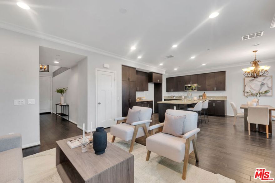 Hidden Gem! Built in 2016, this very rare 3-bedroom, 3-bath townhouse-style condo with no shared walls lives like a single-family home  offering sophistication, modern comfort, and an unbeatable Valley location without the million-dollar price tag.Enter through a grand two-story foyer into a beautifully designed living space that effortlessly blends style and function. The expansive kitchen features abundant cabinetry, a large island with breakfast bar, and an intuitive layout that naturally connects to the dining and living areas  perfect for entertaining or relaxed family living. Sliding doors open to a private patio, creating a seamless indoor-outdoor flow for summer evenings, alfresco dining, or quiet morning coffee.The garage connects directly to the kitchen, making everyday routines effortless. Upstairs, all three bedrooms are thoughtfully arranged alongside a convenient laundry room and linen cabinet. The primary suite impresses with a generous bedroom, walk-in closet, and spa-inspired bathroom, while the additional bedrooms provide ideal space for family, guests, or a home office.Custom shutters throughout enhance the home's timeless appeal, while low-maintenance living is complemented by a community offering exceptional amenities: sparkling pool, BBQ area, outdoor shower, guest bathrooms, playground, and ample guest parking. A security gate is scheduled for installation in 2026, ensuring both peace of mind and a welcoming, family-friendly environment.Located on the cusp of Northridge, you enjoy immediate access to the mall, theaters, dining, shopping, schools, places of worship, and major freeways  combining convenience with lifestyle. With interest rates recently shifting, this move-in ready condo presents an extraordinary opportunity to secure a sophisticated home at exceptional value.Offering both immediate comfort and optional value-add potential, this property allows buyers to enjoy turnkey living while providing room for future personalization and investment​​‌​​​​‌​​‌‌​​‌​​​‌‌​​​‌​​‌‌​​​‌​‌​​​‌‌​ growth.