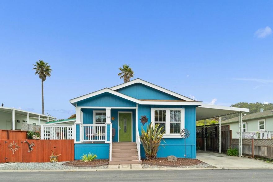 Welcome to your sunny slice of coastal paradise! This bright 2014 3-bed, 2-bath home is all about easy living by the sea. Vaulted ceilings and newer floors make the space light and airy, while the roomy front porch is just begging for morning coffee or evening chats with friends. Love the outdoors? The huge sunny side yard, one of the biggest in the park is perfect for gardening, lounging, or hosting a BBQ. Inside, the primary suite has a walk-in closet and dual-sink bath, and another bedroom opens right to the yard for those fresh ocean breezes. Plus, youll love the oversized shed and convenient carport entry. Life at DeAnzas oceanfront enclave feels like vacation every day. Stroll to your private beach, dip into the heated pool and spa, sweat it out in the sauna or gym, then gather at the clubhouse for potlucks, yoga, or sunset cocktails by the fire pit. Nature is your backyard with tide pools, Natural Bridges, and the Monarch Trail just steps away. And when youre not soaking up the coastal vibe, youre minutes from Santa Cruz, Monterey, or a quick drive to the Bay Area. No property taxes, 55+ park (40+ to own), and fully rentable after six months, this is beach-town fun with a splash of luxury.