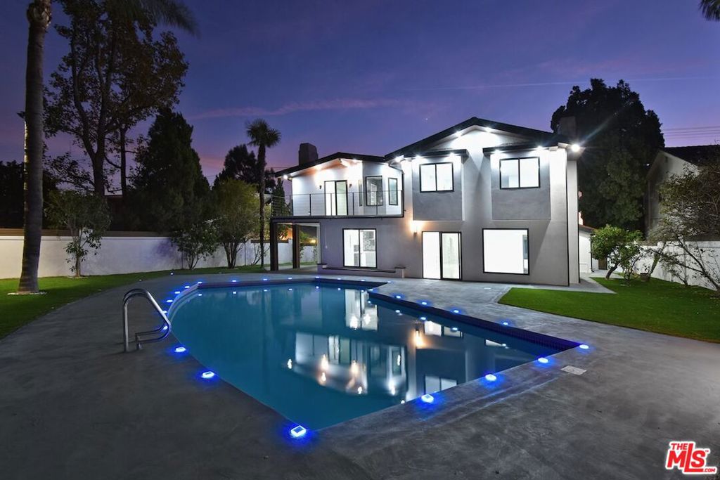 Welcome to your dream, chic home located north of Rinaldi in the heart and quite area of Granada Hills. This ultra-modern masterpiece, completely renewed from top to bottom, offers an elegant living experience with every detail meticulously crafted. As you step into this expansive 3,375 square foot residence, you'll be greeted by an open and airy floor plan that seamlessly blends modern sophistication with luxurious comfort. The home boasts four generously sized bedrooms, each with its own private bathroom and walk-in closet, ensuring privacy and convenience for all residents. One of the bedrooms, along with a full bath, is conveniently located on the first level ideal for guests or as a home office. Bask in the serenity of indoor and outdoor saunas, perfect for unwinding after a long day. Enjoy breathtaking views from every room, enhancing the tranquil ambiance of the home. The kitchen is a culinary artist's delight, featuring a gas stove with six burners and top-rated appliances, designed to inspire your most ambitious culinary creations. Entertaining is a joy in this elegant home. Gather around the cozy fireplace on cool evenings or take the party outdoors to the private pool, providing a perfect backdrop for relaxation and entertainment. The garage is a piece of art in itself, featuring stylish epoxy floors that elevate the space. Situated on a flat, expansive lot, this property offers ample space for creativity and outdoor activities. Experience the epitome of modern living in this sophisticated residence in a great school district.