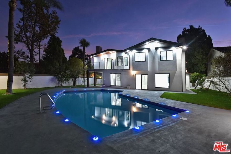 Welcome to your dream, chic home located north of Rinaldi in the heart and quite area of Granada Hills. This ultra-modern masterpiece, completely renewed from top to bottom, offers an elegant living experience with every detail meticulously crafted. As you step into this expansive 3,375 square foot residence, you'll be greeted by an open and airy floor plan that seamlessly blends modern sophistication with luxurious comfort. The home boasts four generously sized bedrooms, each with its own private bathroom and walk-in closet, ensuring privacy and convenience for all residents. One of the bedrooms, along with a full bath, is conveniently located on the first level ideal for guests or as a home office. Bask in the serenity of indoor and outdoor saunas, perfect for unwinding after a long day. Enjoy breathtaking views from every room, enhancing the tranquil ambiance of the home. The kitchen is a culinary artist's delight, featuring a gas stove with six burners and top-rated appliances, designed to inspire your most ambitious culinary creations. Entertaining is a joy in this elegant home. Gather around the cozy fireplace on cool evenings or take the party outdoors to the private pool, providing a perfect backdrop for relaxation and entertainment. The garage is a piece of art in itself, featuring stylish epoxy floors that elevate the space. Situated on a flat, expansive lot, this property offers ample space for creativity and outdoor activities. Experience the epitome of modern living in this sophisticated residence in a great school district.