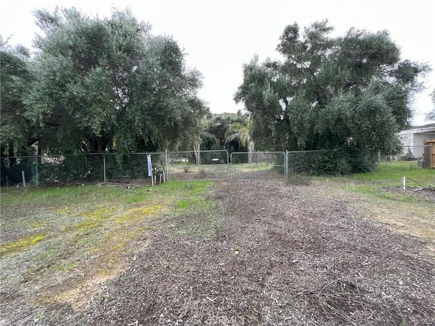 Build Your Dream Home in Lake Elsinore!

This spacious 0.9-acre lot is the perfect canvas for your future home—ideally located just 13 minutes from the lake and 10 minutes from downtown. Set in a quiet residential neighborhood with easy access to major roads, you’ll enjoy the peace of suburban living while staying close to shopping, dining, and entertainment.

Surrounded by elegant villas and custom-built homes—many with swimming pools—this area blends the charm of an established community with the excitement of continued growth. The lot is build-ready with existing utility connections, including gas, electricity, and water, making your construction process smooth and efficient.

The property previously supported a mobile home, confirming its suitability for residential use. A concrete foundation remains, along with a mature garden filled with fruit trees such as oranges, lemons, grapefruits, and olives. Just a block away, cobblestone streets and upscale developments reflect the area's rising value and appeal.

Whether you're dreaming of a cozy cottage or a modern luxury home, this lot provides the space and flexibility to make it happen. Don’t miss this rare opportunity to own land in one of Lake Elsinore’s most desirable and fast-growing neighborhoods—where nature, convenience, and creativity come together.