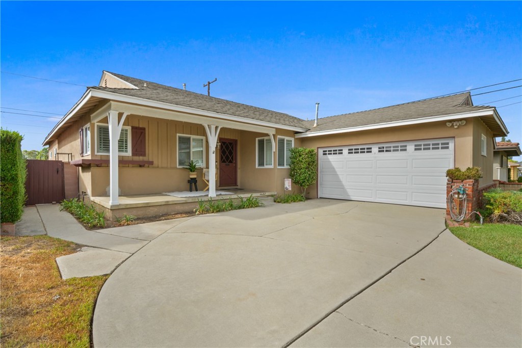 Welcome to this beautifully maintained 3 bedroom, 2 bathroom home located in the sought after East Whittier neighborhood. Offering 1,898 sq ft of living space, this home perfectly blends charm, functionality, and modern updates. From the inviting covered front porch, ideal for morning coffee or evening relaxation, step inside to find an open and spacious floor plan. The large kitchen is a true highlight, featuring a center island, built-in banquette seating, and plenty of room for a dining table. This space flows seamlessly into the family room with vaulted ceilings and French doors, opening to the backyard for indoor/outdoor living. An additional living room with a cozy fireplace provides the perfect setting for movie nights or gatherings. A convenient work/study nook with built-in desk makes working from home or studying a breeze. Throughout the home, you’ll appreciate the warmth of hardwood floors, as well as newer paint and abundant natural light. Both bathrooms have been recently renovated with new tile showers, updated sinks, and stylish flooring, creating a spa like feel. A newer AC unit and water heater provide comfort and peace of mind. Step outside to a backyard designed for entertaining, complete with a covered patio perfect for weekend gatherings, summer parties, or casual dinners al fresco. Situated near the Whittwood Town Center, top-rated schools, shopping, dining, and parks, this home offers the best of East Whittier living in a welcoming neighborhood. Don't Miss this opportunity. A Must See!