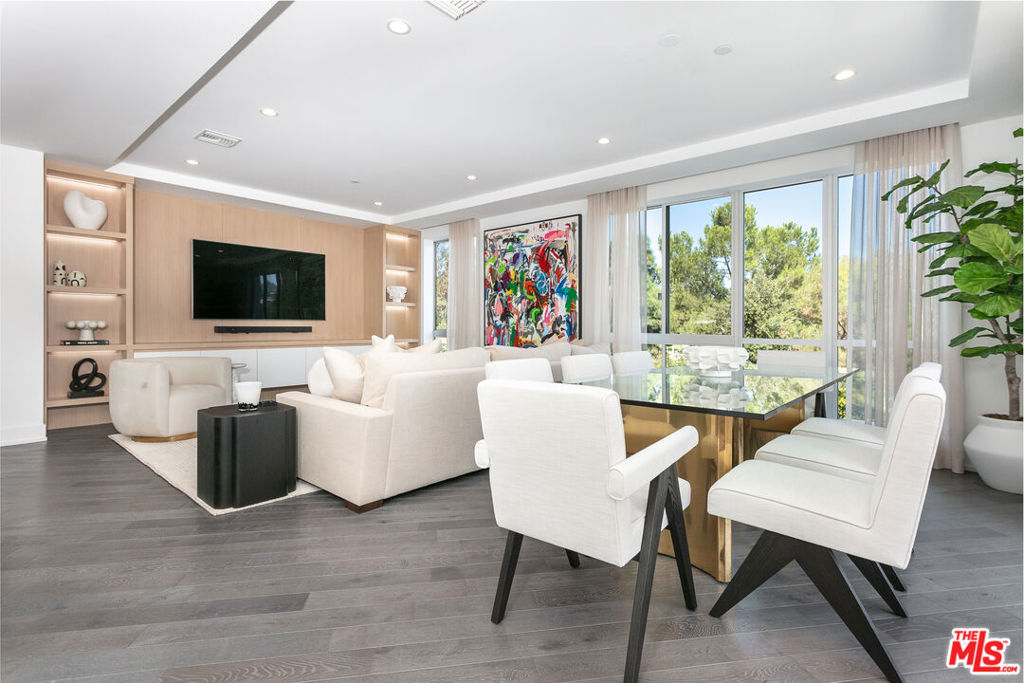 Luxury fully furnished lease in Beverly Hills starting Oct 1, 2025! Location, Location, Location! Discover this stunning 3BR, 4BA condo in the heart of Beverly Hills, situated on a picturesque tree-lined street. This corner, northeast-facing unit is filled with natural light and features an elegant floor plan. Enjoy the chef's kitchen with a generous center island, Sub-Zero and Miele appliances, Ceasarstone countertops, Italian cabinetry, and hardwood flooring. The master suite has a spacious sitting room, large master closet, and private outdoor patio. There is an oversized bathroom with double vanities and a luxurious soaking tub. In addition, there are two en-suite bedrooms with ample closet space, a laundry room and walk-in linen closet. Enjoy a cup of coffee on a private patio that has Fleetwood doors that open up to a tranquil patio with beautiful treetop views. This unit is fully furnished including all kitchenware/linens. Building amenities include 24-hour concierge, a business lounge and a state-of-the-art fitness center. 3 side by side parking spaces.