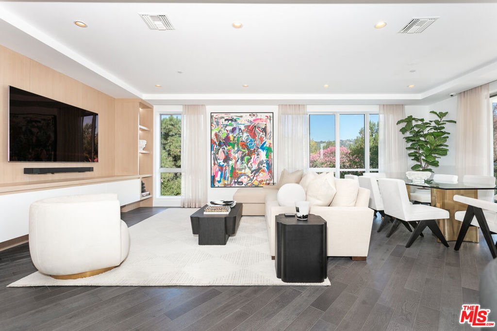 Luxury fully furnished lease in Beverly Hills starting Oct 1, 2025! Location, Location, Location! Discover this stunning 3BR, 4BA condo in the heart of Beverly Hills, situated on a picturesque tree-lined street. This corner, northeast-facing unit is filled with natural light and features an elegant floor plan. Enjoy the chef's kitchen with a generous center island, Sub-Zero and Miele appliances, Ceasarstone countertops, Italian cabinetry, and hardwood flooring. The master suite has a spacious sitting room, large master closet, and private outdoor patio. There is an oversized bathroom with double vanities and a luxurious soaking tub. In addition, there are two en-suite bedrooms with ample closet space, a laundry room and walk-in linen closet. Enjoy a cup of coffee on a private patio that has Fleetwood doors that open up to a tranquil patio with beautiful treetop views. This unit is fully furnished including all kitchenware/linens. Building amenities include 24-hour concierge, a business lounge and a state-of-the-art fitness center. 3 side by side parking spaces.