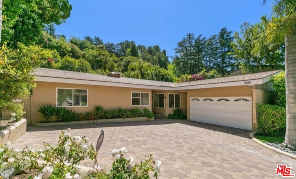 Tranquil and Spacious 3 bedroom, 2.5 bathroom home, located in one of the finest areas of Brentwood, North of Sunset. Living room, primary bedroom, den/family room off of the kitchen, all face a private backyard with a heated pool and lush landscaping. There are two other additional bedrooms with a shared bathroom. The primary bedroom has a spa bath tub and separate stalled shower. The large kitchen features built-in appliances and connects to the laundry room leading to an attached garage. The living room has a fire place and skylight. Additional features include newer central HVAC, recessed lightings, hardwood flooring and security camera system throughout. Lovely home for family style living and entertaining.