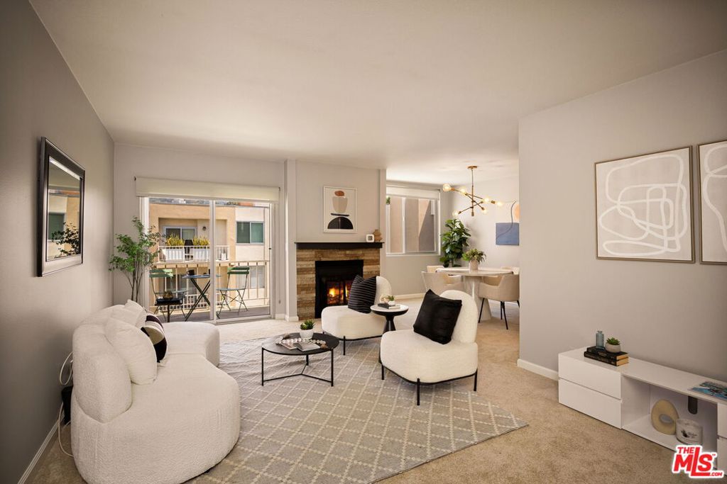 This bright and spacious one-bedroom, one-bath residence offers more than 900 square feet of comfortable living space, complemented by a private balcony ideal for moments of quiet escape. The home features new carpeting, a spacious living area with a stone-faced fireplace, wet bar and separate dining area. An updated kitchen with granite countertops, stainless steel appliances, and sleek modern cabinetry includes a breakfast alcove. The oversized bedroom features a walk-in closet with abundant storage, while the bathroom offers dual vanities and a shower/tub combination. Additional features include central heating and air conditioning, two gated secure parking spaces (tandem), and an option for the installation of in-unit laundry (ventless washer and dryer). This secure building offers a central courtyard with a heated pool and a relaxed community atmosphere. Monthly HOA dues of $654 cover water, trash, a TV package, and earthquake insurance. Recent building improvements include a new roof (2024), with plans underway for renovations of the lobby, pool deck, and exterior--enhancing both aesthetic appeal and long-term value. Located just south of Santa Monica Boulevard, this home is moments from some of West Hollywood's best dining, shopping, and nightlife.