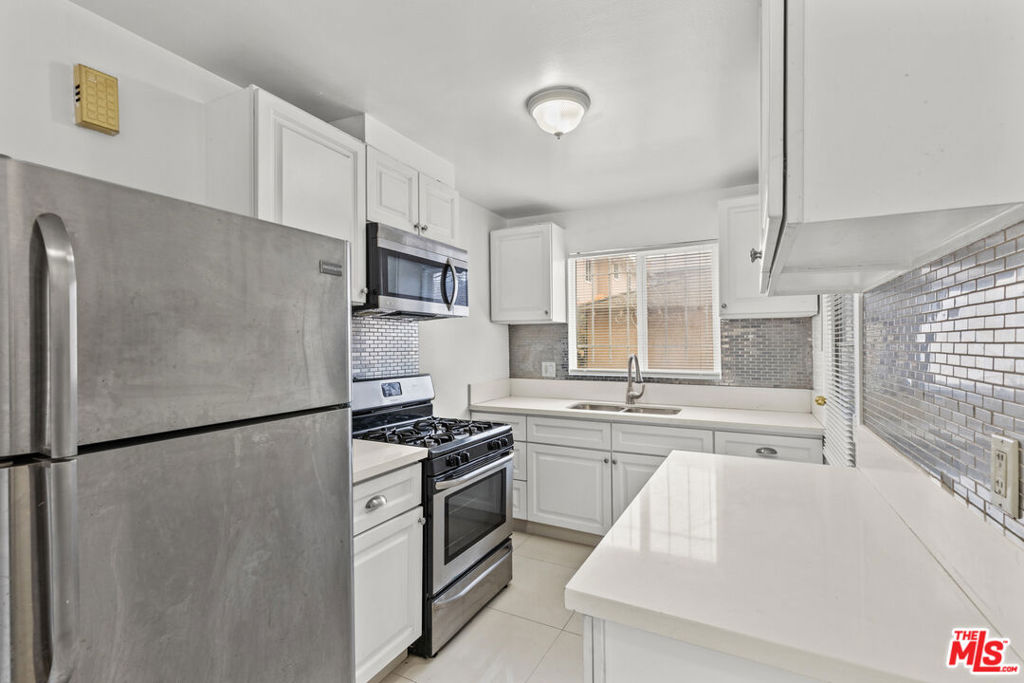 Welcome to 4108 Santa Rosalia Dr #A, a charming and spacious first-floor condo offering 2 bedrooms and 1 bathroom in the heart of Los Angeles. This beautifully updated home features tile flooring in the living room and good sized bedrooms. The updated kitchen boasts newer cabinetry, sleek countertops, and stainless steel appliances, while the bathroom has been thoughtfully remodeled for comfort and convenience. Enjoy the ease of garage parking and the unbeatable location. Situated near Kaiser Hospital, the Crenshaw Baldwin Hills Mall project, and a variety of shops and restaurants, this home places you just moments from everything you need. Additionally, it's conveniently located near Culver City, making it a perfect hub for work, play, and relaxation. Don't miss this fantastic opportunity to own a stylish and well-appointed condo in a vibrant neighborhood!