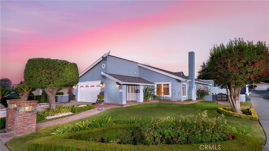 Upgraded single-story, ideally situated on a corner lot. Lush custom landscaping, elegant concrete brickwork, & thoughtfully designed custom lighting set a warm & inviting tone.The home's curb appeal is matched by its interior charm, with a striking single-door entry featuring sidelights & beveled leaded glass. Inside, an inviting foyer with custom tile that opens to a spacious living room complete w/fireplace, a beautifully detailed mantle, and more intricate tile work, with high vaulted ceilings. Natural white oak hardwood floors flow throughout the main living areas, complemented by energy-efficient Milgard windows (with a lifetime warranty) and LED lighting. The heart of the home is the gourmet kitchen, a chef's dream. Featuring granite countertops w/triple edging, custom tile backsplash, & premium stainless steel Viking appliances. Each bedroom offers comfort & style with new carpet, ceiling fans & shutters. The hallway bathroom features a sunken jetted Jacuzzi tub, a frameless glass shower door, & Kohler LED lighted mirrors. This bathroom is thoughtfully outfitted with high-end U by Moen smart shower system, fully integrated w/ Alexa voice control, 3 intuitive control options: voice command, smartphone app, & a wall-mounted controller. With the Alexa integration, you can start your shower using just your voice or through the Alexa app. The system allows for precise control of water temperature and flow. The master suite features ceiling fans, LED recessed lighting, & a built-in 5.1 surround sound system. Walk-in closets include custom organizers & a separate, illuminated closet with a custom-built shoe organizer. The spa-inspired master bathroom offers a deep-soaking jetted tub, a frameless walk-in shower w/multiple sprayers, custom tile finishes, & built-in surround sound for the ultimate experience. Step outside into your own private backyard retreat. A custom BBQ island, lush landscaping and lighting, tranquil waterfall feature create a serene environment for outdoor living. Spacious 2-car garage offers a double-insulated door, tankless water heater, and full audio/video wiring setup. The home also boasts smart features, including a Brinks security system, smart thermostat, & Alexa-enabled smart-home shower and tub systems. Situated on a desirable corner lot, this home offers added privacy & extra outdoor space, enhancing its tranquil atmosphere. Recent upgrades include NEW ROOF, newer HVAC system, providing peace of mind and modern efficiency.