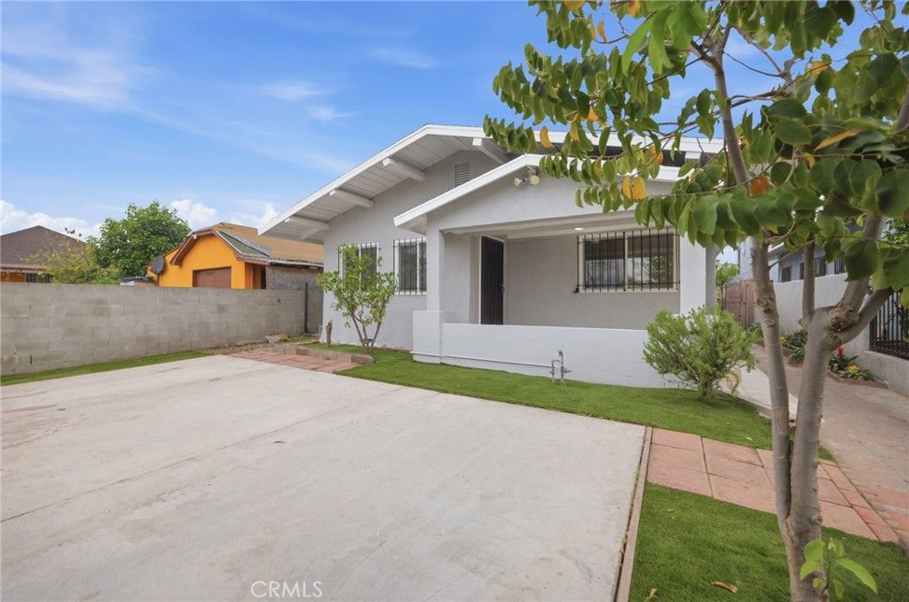 Photo of 1345 W 51st Place, Los Angeles, CA 90037 (MLS # SB26065658)