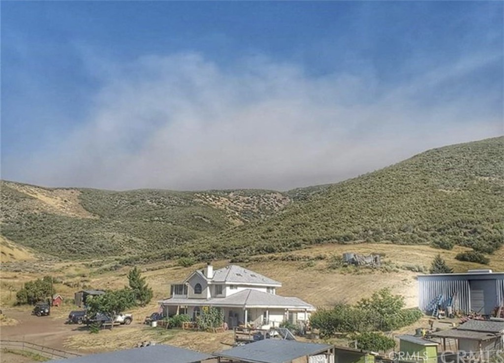 Come live on a fully functional ranch in Leona Valley, a pandemic retreat, where you grow your own food and raise your animals in a small town setting. The property has over 2,000 square feet of living space with 3 bedrooms and 3 full bathrooms. 1 bed and 1 bath downstairs. Upstairs are 2 bedrooms and 1 newly remodeled bathroom. Remaining house has a country kitchen, living room, dining room, family room and a bath all downstairs as well. Open sitting area/ den and enclosed sunroom. Property has a 5000 gallon water tank and well, a 30ft by 60 ft metal shop, 3 chicken coops, 4 covered horse stalls and arena. 3 covered stalls are 24ft y 24 ft, the other is 24 ft by 48 ft with an arena 145 ft long by 80ft wide. 3 small animal pens. Covered hay area and 20ft container used as a tack room. Too may amenities to list.