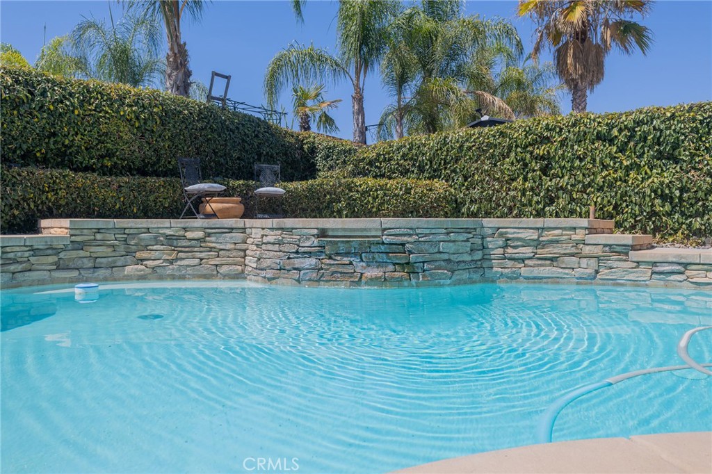 Welcome to Murrieta west side.
A masterpiece of comfort and elegance nestled in one of Murrieta’s most sought-after neighborhoods. This meticulously cared-for home blends modern sophistication with timeless charm, offering an unparalleled living experience tailored to meet the needs of today’s discerning homeowner.
Step through the beveled-glass entrance into a sunlit sanctuary, where soaring ceilings and an open-concept design create a warm, inviting atmosphere. The heart of the home is the gourmet kitchen, featuring granite countertops, custom cabinetry, stainless steel appliances, and a generous island—perfect for hosting family and friends. Adjacent to the kitchen, the family room offers a cozy retreat with serene views of your lush backyard created for entertaining. Upstairs, the thoughtfully designed layout features spacious bedrooms that serve as tranquil havens. The luxurious primary suite is a standout, offering large walk-in closet. A versatile bonus room invites endless possibilities for a home office, gym, or playroom, adapting effortlessly to your lifestyle.The backyard is your personal paradise—with manicured, low maintenance landscaping, an oversized covered patio, a sparkling swimming pool and elevated spa, and a built-in BBQ with an outdoor kitchen. This space is ideal for entertaining or savoring quiet evenings under the stars.Additional highlights include an extra large laundry room with ample cabinetry and a large utility sink for convenience. For those seeking flexibility, the home boasts a fifth bedroom with its own private entrance and a ¾ bathroom, perfect for a Gen X suite, rental income, or a private guest retreat.Car enthusiasts will love the three-car garage with a remarkable 40-foot depth, capable of accommodating large vehicles or a boat.
Situated in a pristine, manicured neighborhood, this home offers the perfect balance of tranquility and accessibility. You’ll be just minutes from top-rated schools, parks, shopping, dining, and everything Murrieta has to offer.
Low tax rate and No HOA!