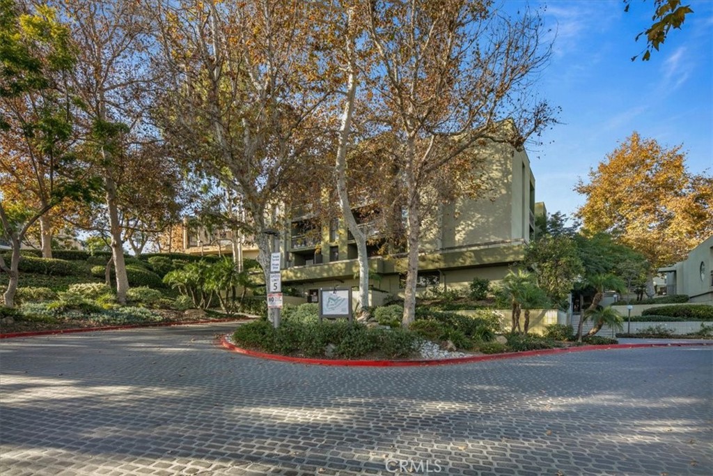 Welcome to Temple Terrace, a modern oasis in the heart of Los Angeles. This first floor home offers a rare opportunity to purchase a unit with a vast private patio that provides an incredible outdoor living space! Overlooking the pool, this feels like resort living. This stylish 2-bedroom, 1-bathroom residence also offers a spacious and comfortable living space, perfect for those seeking a blend of urban convenience and serene living.
Step inside to discover a thoughtfully designed interior featuring a remodeled kitchen with a sleek breakfast bar, ideal for casual dining and entertaining. The open layout seamlessly connects the living area, creating a welcoming atmosphere for relaxation and gatherings. Enjoy the convenience of a washer and dryer in the unit and Central Heat/AC.
Residents will appreciate the common outdoor space, including pool and spa, perfect for enjoying the California sunshine, and the convenience of an elevator for easy access. Parking is a breeze with 2 assigned garage parking spaces with EV charging available.