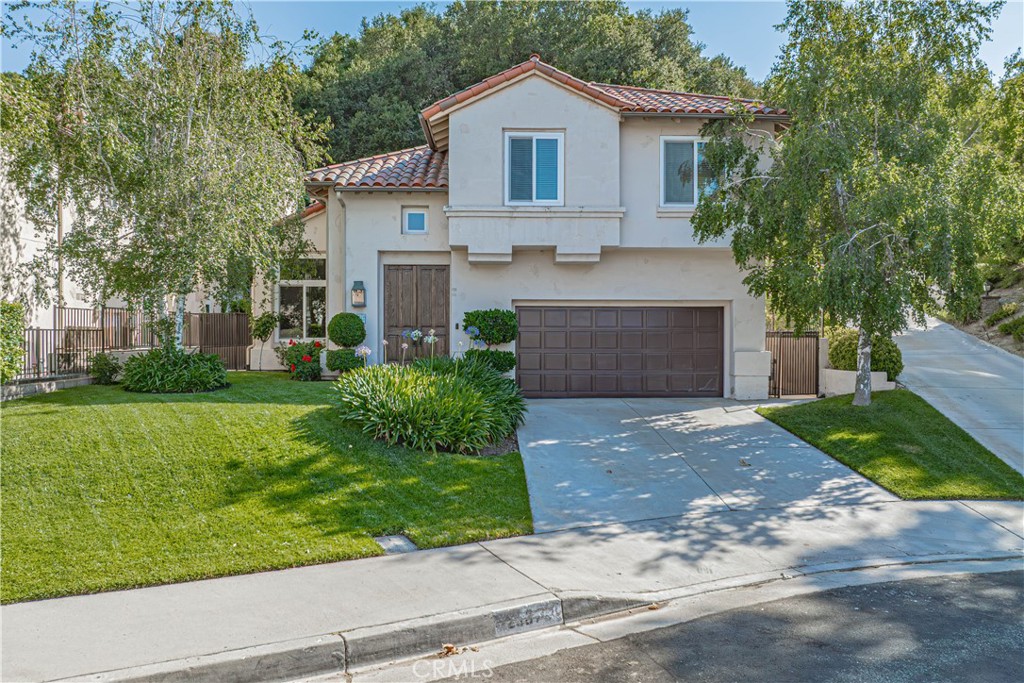 Discover this charming 4-bedroom, 3-bathroom home nestled on a quiet cul-de-sac. Conveniently located off the first exit into Santa Clarita and close to the 5 freeway for those who commute for work. Step inside to soaring high ceilings that create an open and inviting atmosphere. The recently painted interior complements the updated bathrooms and new flooring in the master bathroom, featuring modern faucets. The spacious kitchen boasts dual ovens, updated cabinetry, and elegant granite countertops, perfect for entertaining.
Upstairs, enjoy the comfort of brand-new carpet and the convenience of an upstairs laundry room. All downstairs windows are adorned with stylish shutters, adding charm and functionality. The beautifully landscaped backyard offers lush new sod and mulch, providing a serene outdoor retreat. Located right next to the community pool and park, this home combines comfort, style, and convenience for the ideal living experience.