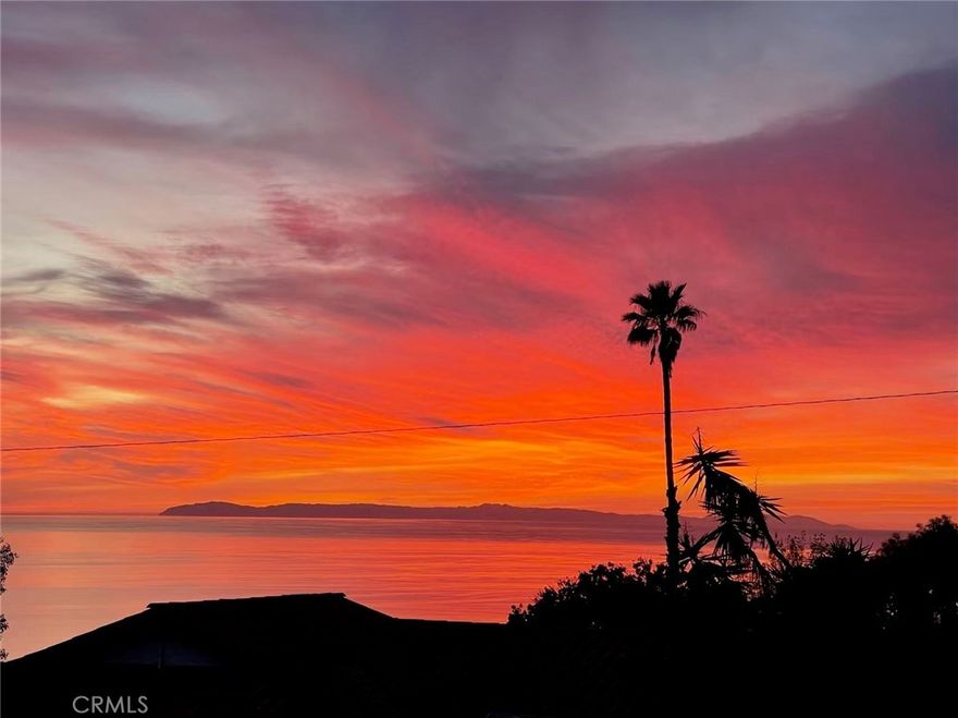Welcome to 2870 Zell Drive, a beautifully detailed coastal retreat in Laguna Beach’s highly desired Top of the World neighborhood. Positioned to capture ocean, Catalina, and sunset views, this home offers the perfect blend of relaxed comfort and timeless charm. The main level features an open-concept layout with chevron-patterned hardwood floors, a statement fireplace, and a floor-to-ceiling glass-enclosed wine display. The chef’s kitchen includes Thermador stainless-steel appliances, a built-in refrigerator, walk-in pantry, and a center island, all opening to the dinning and family room plus a spacious front patio ideal for indoor-outdoor entertaining. Upstairs, the primary suite showcases ocean and sunset views, a private balcony, and a spa-inspired bath with a free-standing soaking tub and designer finishes. Two additional bedrooms and a full bath complete the second level, along with an expansive ocean-view deck featuring a built-in wet bar and generous lounge space for outdoor dining and enjoying coastal sunsets.
Located minutes from Laguna’s award-winning schools, hiking trails, and world-class beaches, this residence captures the essence of modern coastal living in one of the area’s most sought-after enclaves.