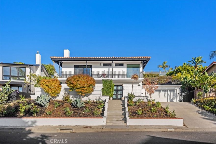 Welcome to 2870 Zell Drive, a beautifully detailed coastal retreat in Laguna Beach’s highly desired Top of the World neighborhood. Positioned to capture ocean, Catalina, and sunset views, this home offers the perfect blend of relaxed comfort and timeless charm. The main level features an open-concept layout with chevron-patterned hardwood floors, a statement fireplace, and a floor-to-ceiling glass-enclosed wine display. The chef’s kitchen includes Thermador stainless-steel appliances, a built-in refrigerator, walk-in pantry, and a center island, all opening to the dinning and family room plus a spacious front patio ideal for indoor-outdoor entertaining. Upstairs, the primary suite showcases ocean and sunset views, a private balcony, and a spa-inspired bath with a free-standing soaking tub and designer finishes. Two additional bedrooms and a full bath complete the second level, along with an expansive ocean-view deck featuring a built-in wet bar and generous lounge space for outdoor dining and enjoying coastal sunsets.

Located minutes from Laguna’s award-winning schools, hiking trails, and world-class beaches, this residence captures the essence of modern coastal living in one of the area’s most sought-after enclaves.