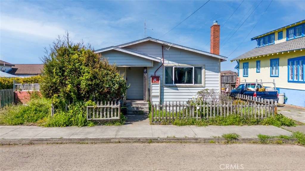 Ocean views from this charming single-level home! 3 bed and 1 bath, featuring a newer roof, updated kitchen and bathroom vanity, and beautiful hardwood floors in the living room with a newer dual pane window facing the street. With 1046sqft in size and ocean views from the kitchen and laundry windows, this home has such potential. The detached storage shed is an ample size, and the attached greenhouse has potential for your future gardening needs.