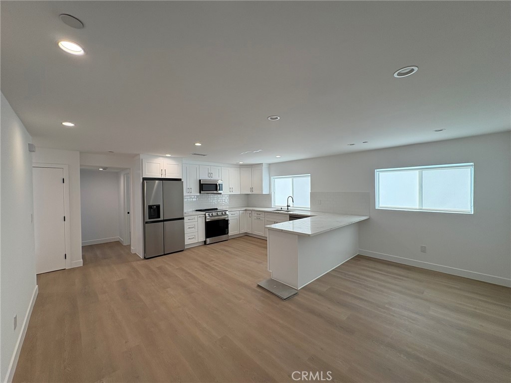 Brand New Construction Unit available for lease! Built in 2024 and centrally located in the heart of the Van Nuys! This is a stunning MODERN unit with an estimated 1,595 square feet of interior space with 4 bedrooms and 4 bathrooms. A sleek modern designer kitchen is equipped with stainless steel appliances including a Fridge, Stove/Oven, New Washer/Dryer, and ample cabinet space with aesthetic hardware. A spacious living and dining area is designed with clean finishes, and offers abundant natural lighting! 3 of the bedrooms have en-suite bathrooms. 1 of the bedrooms is located on the first floor. Make an appointment to see this property today as this one won't last!
