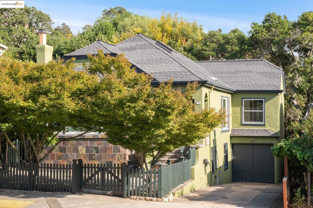 Full of character and warmth, this quintessential Thousand Oaks home features tray ceilings, archways, built-ins, and graciously sized rooms. The inviting living room with gas fireplace, formal dining room, and updated eat-in kitchen with quartz counters, stainless appliances, and freshly painted cabinets create a perfect flow for everyday living. Three bedrooms include a serene primary suite with spa-like bath. A finished attic and versatile lower level offer flexible bonus spaces. The magical backyard, framed by rock outcroppings, majestic oaks, and an outdoor fireplace, is ideal for relaxing or entertaining. Additional highlights include hardwood floors, a wood shop, plenty of storage and a one-car garage with internal access. Located in the much sought after neighborhood of Thousand Oaks. A peaceful retreat, just a short walk to Solano Ave shops, cafes and restaurants. A quick jaunt down to the 580 and 80 freeways that makes commuting a dream! This location cannot be beat.