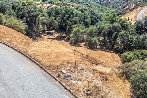Photo of 13582 Oak Mountain Drive, Yucaipa, CA 92399 (MLS # IG26136941)
