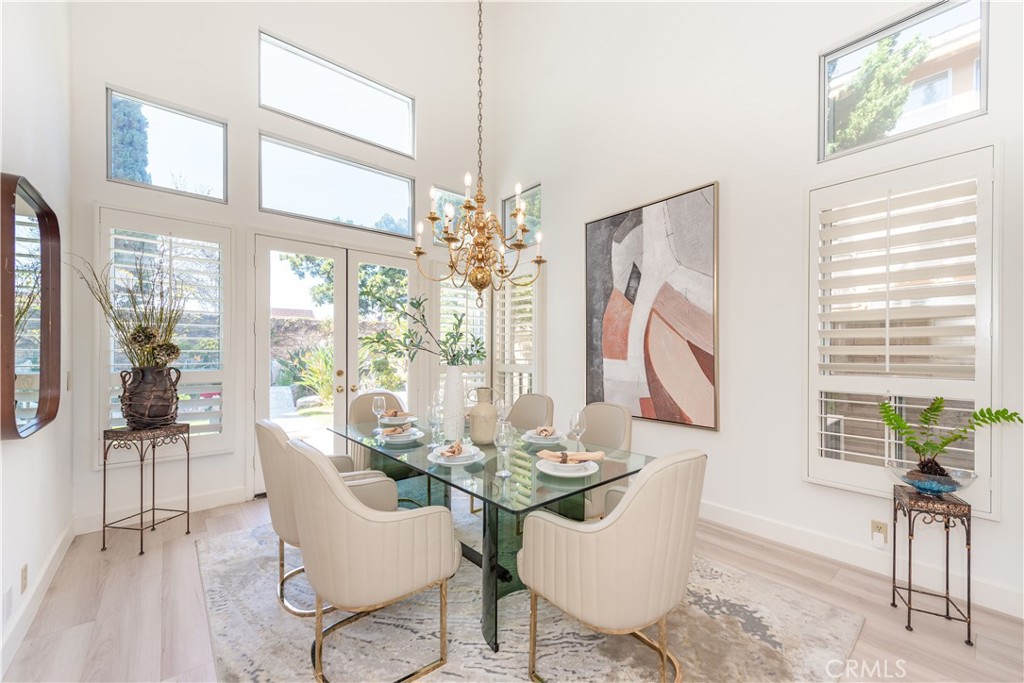 Welcome to the luxurious Brentridge neighborhood- one of Cerritos' most sought after upper scaled communities (no HOA no Mello Roos). 18817 Jeffrey offers nearly 3,500 sq. ft. living space with magnificent architecture masterpiece: a truly BRIGHT & OPEN floor plan, 4 generously sizeable bedrooms, a spacious upstairs BONUS ROOM/optional 5th BR, 4.5 bathrooms, formal dining room, 3 fireplaces, huge kitchen, vast primary bedroom suite, 3-car garage and a large & tranquil backyard with BBQ setting & lily pond. It also has the most desirable 1 bedroom 1 bath plus additional powder room on ground level (making total 3 en-suite bedrooms for this house). Greeting you upon entry is the grand LIVING ROOM that holds cathedral ceilings, clerestory windows, plantation shutters, and a beautiful fireplace. An impressive FORMAL DINING ROOM furnishes a 2-story ceiling height chandelier, with French door leading to backyard. The entertaining FAMILY ROOM provides fireplace and wet bar. Large gourmet KITCHEN with lots of countertops & cabinetry spaces and a BREAKFAST NOOK. Exceptionally affluent PRIMARY BEDROOM EN-SUITE adorned with 3rd fireplace, high ceilings, his/her walk-in closets, retreat area, private toilet room, dual vanities, separate shower and soaking tub. Rooms on 2nd floor all come with wide windows and high ceilings which offer generous natural lights & cheerful atmosphere. Professionally hardscaped front yard with great curb appeal. Backyard has matured fruit trees (pink grapefruit, Fuji apple & persimmon) and a potential outdoor kitchen (can be modified from its built-in gas BBQ grill and sink). New quality waterproof laminated wood flooring. New interior textured paint. Conveniently located within walking distance to Leal Elementary, Cerritos High, Heritage Park, Regional Park, Cerritos Performing Arts Center, the Library, and Cerritos Towne Center. Enjoy 3-D tour at: https://my.matterport.com/show/?m=oB22BQ39ezQ&brand=0