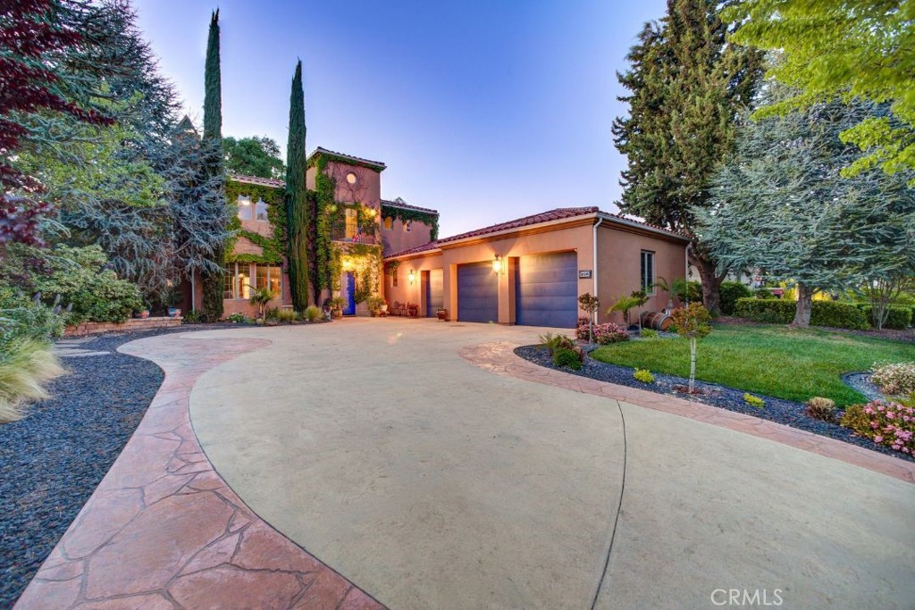 Welcome to “Casa Vista Cerro” — a Tuscan-inspired retreat nestled in the prestigious Del Oro neighborhood of Paso Robles. With over 3,300 square feet of timeless design and refined living space, this two-story estate offers the perfect blend of elegance, comfort, and everyday functionality.
From the moment you step through the grand entryway, you’re welcomed by soaring ceilings, natural light, and a sense of warmth that carries throughout the home. Rich wooden ceiling beams and a striking stone fireplace anchor the expansive living room, creating a warm and inviting atmosphere for both relaxing nights in and memorable gatherings.
At the heart of the home is a thoughtfully designed kitchen, featuring hardwood flooring, a luxurious copper sink, custom glass-front cabinetry, an island with a secondary prep sink, and a stylish backsplash. Whether you’re hosting guests or enjoying a quiet morning coffee, the kitchen flows beautifully into the home’s open layout.
The main-level primary suite is a true retreat — complete with its own fireplace, peaceful views of the backyard and pool, and direct access to outdoor living. The ensuite bath is spa-inspired, offering a soaking tub, separate shower, bidet, and heated toilet. A custom-designed walk-in closet with dual access from both the bedroom and bathroom adds a layer of luxury and practicality.
Upstairs, you’ll find three spacious bedrooms, a shared full bath, and a versatile flex space perfect for a media lounge or an additional living space.
Outside, the backyard is your own private oasis. Lounge by the pool, enjoy sunny afternoons under the covered patio, or entertain family and friends. The spacious driveway offers ample room for RV or oversized vehicle parking, while the attached three-car garage adds convenience and storage flexibility.
Additional features include 6-inch soundproof walls for enhanced privacy, elegant French windows on the lower level, a dedicated laundry room, and a quiet office area for remote work or study.
Ideally located with easy access to Highway 46, you're just minutes from world-renowned wineries, local shopping, and Paso Robles High School.
With its blend of luxurious finishes, thoughtful design, and prime Paso Robles location, “Casa Vista Cerro” offers a rare opportunity to experience elevated living in one of Paso Robles’ most desirable neighborhoods.