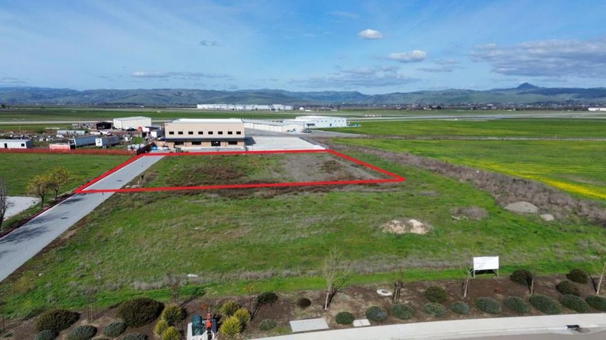 Prime 1-acre airport-accessible industrial lot on Airway Drive, Hollister, CA, zoned Airport Support (AS) and strategically located next to Hollister Municipal Airport (KCVH). This property offers potential direct airport access, subject to City of Hollister approval, making it an ideal opportunity for aviation-related businesses, warehousing, manufacturing, or logistics. Hollister Municipal Airport features a 6,350-foot primary runway and a 3,149-foot secondary runway, with full-service FBO support, fuel services, and uncongested airspace for seamless operations. With utilities available and easy access to Highways 25, 156, and 101, this lot is a rare investment opportunity in a growing industrial hub.