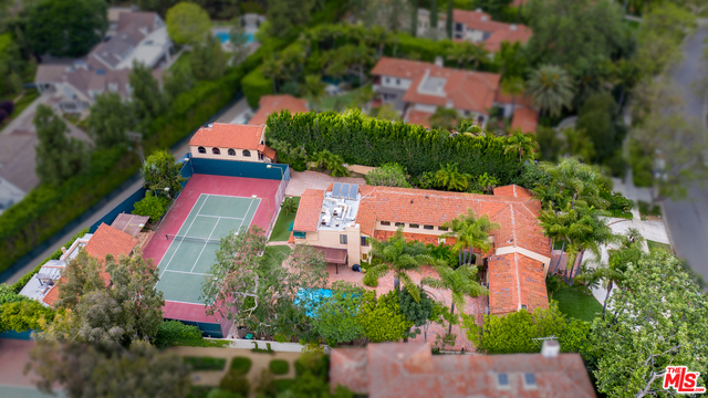 Once in a generation. A chance to own on the 50 yard line on the 1000 block of Roxbury Drive. By far the most prime location in all of Beverly Hills. A+++ in every way, spectacular light and wonderful lot dimensions. Over 33,250sqft flat as a pancake. Full tennis court, 2 guest houses. First time available in over 45 years.