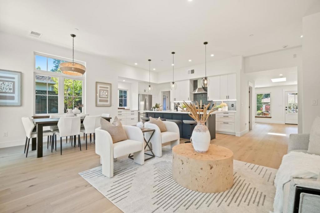 Effortless California living in this light-filled modern retreat in sought-after Flood Park neighborhood. Thoughtfully expanded in 2024 and rebuilt with premium finishes and clean, contemporary design, this single-level stunner is ideal for indoor-outdoor living and entertaining. At the heart of the home is a spacious great room, dining area and a chef's kitchen featuring 10 foot ceilings, wide-plank European Oak hardwood floors, island with sink, quartz countertops, stainless steel appliances, and wood cabinetry. The serene primary suite offers a private sanctuary with walk-in closet with built-ins and a spa-like bath, complete with double sinks, freestanding tub and a walk-in shower. With four bedrooms total, plus a bonus room/office, there is plenty of space to work, host, or unwind. Oversized laundry/mudroom with extensive cabinetry and storage options. Step outside to the spacious patio and landscaped backyard perfect for gatherings and play. Upgrades include a brand-new roof, furnace, tankless water heater, all-new plumbing and electrical. Top-rated Menlo Park Schools. and just blocks from the newly renovated Flood Park with its picnic areas, sports fields and trails. This home blends thoughtful design, modern comfort, and a highly desirable community location.