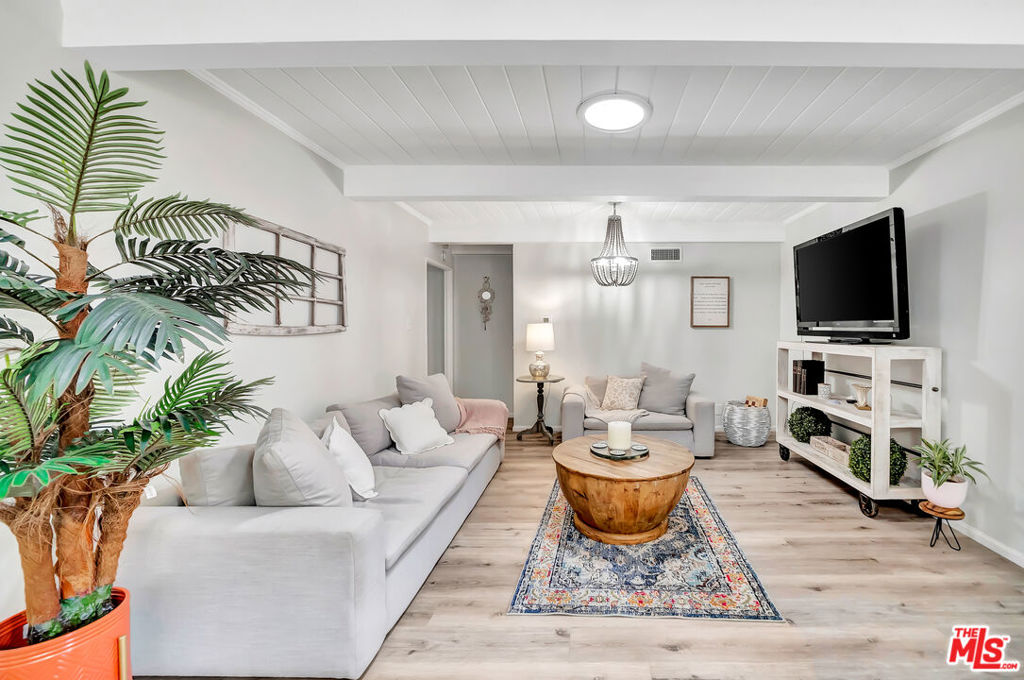 Discover comfort, style, and everyday convenience in this beautifully maintained 3-bedroom, 2-bathroom home, nestled in a quiet, family-friendly neighborhood of Woodland Hills. Perfectly suited for long-term living, this property offers a seamless blend of functionality and charm in one of the area's most sought-after communities. Step into a bright and spacious open-concept kitchen layout, where natural light pours in through windows and skylights creating a sense of airiness and warmth. The living area is perfect for everyday relaxation or hosting friends. The thoughtfully updated kitchen is fully equipped with modern appliances, generous counter space, and a welcoming layout ideal for everything from weeknight dinners to holiday entertaining. The serene primary suite looks out to the private backyard and two additional bedrooms offer flexibility for family and guests. Enjoy your private, fully fenced backyard year-round. Whether it's summer barbecues, quiet morning coffee, or evening meals under the stars, the patio and low-maintenance landscaping provide the perfect outdoor escape. As an added bonus, the attached garage includes a newly finished bonus room with its own AC unit great for use as a home office, workout space, or creative studio. Located just minutes from top-rated schools, parks, shopping centers, and dining options, this home offers easy access to everything you need for comfortable long-term living. And with Malibu's beaches only 20 minutes away, weekend getaways are always within reach. This home is more than just a rental, it's a place to settle in, grow, and truly feel at home.