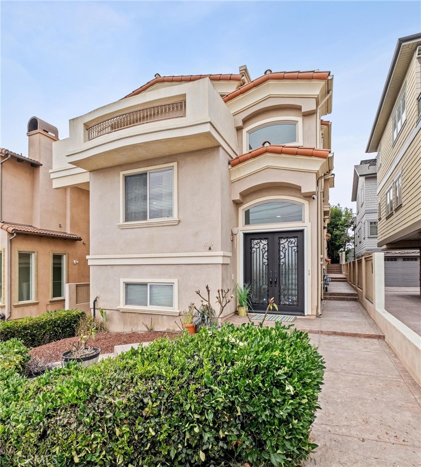 This spacious ocean view 4-bedroom, 4-bath custom townhome (2 on a lot) is just blocks to Hermosa and Redondo beaches and close to award-winning schools. Enter through grand wrought-iron doors to wood floors and a sweeping staircase. The lower level features a private bedroom with en suite bath, walk-in closet, and direct garage access. Upstairs, the primary suite boasts a fireplace, oversized walk-in closet, and spa-like bath. Two additional bedrooms share a Jack & Jill bath, each with walk-in closets. The top main living level showcases soaring ceilings, a light-filled living room with fireplace, built in cabinet, double pane windows, a deck, large formal dining, and a gourmet kitchen with stainless steel appliances. There's also a guest bath, a separate laundry room and access to the roof top deck where you'll enjoy sweeping ocean views and sunsets! Close to top restaurants, shopping, biking and water activities. Nearby Plant is inactive.