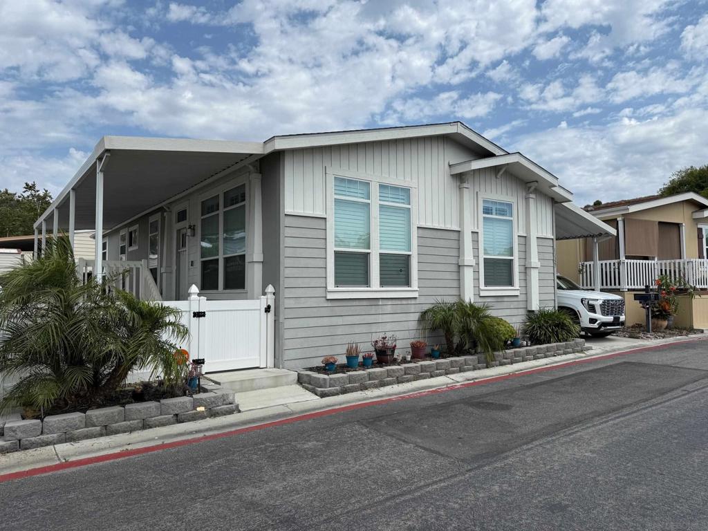 Move in ready and priced to impress. This beautifully upgraded 2018 manufactured home offers 3 bedrooms, 2 bathrooms, and a light filled open layout. The Chef inspired kitchen boasts a large center island, gleaming white countertops, custom tile backsplash, and stainless-steel appliances. Perfect for both everyday living and entertaining. Recent updates include plantation shutters throughout, a remodeled primary bath, and a Culligan soft water system for added comfort. Enjoy resort style living with access to a fitness center, tennis courts, two sparkling pools, and dual clubhouses ideal for gatherings. Located in a highly desirable Poway community with easy access to shopping, dining and award-winning schools.