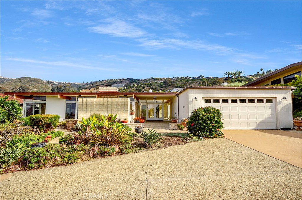 Coastal Elegance in Monarch Bay Terrace
Nestled at the end of a quiet cul-de-sac in the coveted Monarch Bay Terrace community, this beautifully upgraded single-level home captures the essence of California coastal living. With 4 spacious bedrooms and 4 elegant baths, it offers a seamless blend of sophistication and comfort across nearly a quarter-acre of pristine land. Soaring ceilings, floor-to-ceiling windows, and abundant natural light invite the ocean views and the outdoors in, creating a serene and airy ambiance. Exquisite marble, stone, and wood floors flow throughout, while track lighting and a cozy brick fireplace add warmth and character. The huge chef’s kitchen with stainless steal appliances, Double sinks, a large butlers pantry/ laundry room, open to the living areas, is a true showpiece, showcasing stunning vistas and premium finishes. All bathrooms, including the en-suite premier bath are nicely upgraded. Home boasts lots of storage throughout. Outside, a sparkling pool and spa complete this coastal retreat—where refined living meets the beauty of the California Riviera. Close to the Dana Point Harbor, Fabulous restaurants, super markets, Ocean Ranch Theater, and great schools.