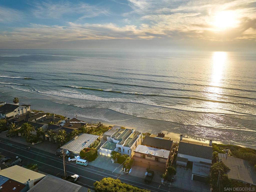 With private stairs leading directly to the beach, this 4BD, 4BA retreat provides access to The Surf, The Sand & The Lifestyle. Set on a 10,119-sqft oceanfront lot w/a sweeping garden patio, experience an exclusive piece of Leucadia’s coastal character. Sophisticated & laid-back, the main level features a seamless flow between the living & dining; upstairs 2 of the 4 bedrooms feature ocean views from the balconies & the primary suite bathtub. Plus: 2-car garage, 4 driveway parking spots, an ocean-view office, tons of storage. Major perk: Walk to the buzzy restaurant scene. Barefoot Luxury | Private steps to The Surf, The Sand & The Lifestyle With private stairs leading to the sand, this beautifully built retreat creates a sense of escapism and spirit of place. Set on a 10,119-sqft oceanfront lot with 50 feet of ocean frontage, the 4BD, 4BA 3,500-sqft house is sophisticated, comfortable—and bragworthy with front-row views of Grandview surf break from the garden patio. To live here is to experience an exclusive piece of Leucadia’s coastal character in walking distance to iconic beaches and a buzzy restaurant scene. Inside, the floorplan is laid-back and inviting, designed for ease of use. The spacious living room features a fireplace and ocean views; upstairs two of the four bedrooms feature balconies and ocean views—including an epic view from the primary suite bathtub. Major perk: 2-car garage and 4 driveway parking spots. Plus: An ocean-view office and abundant storage. The large oceanfront patio features a jacuzzi, grilling area, garden and private stairs, which have been recently reinforced. The property is an immersion of beach vibes and luxury.