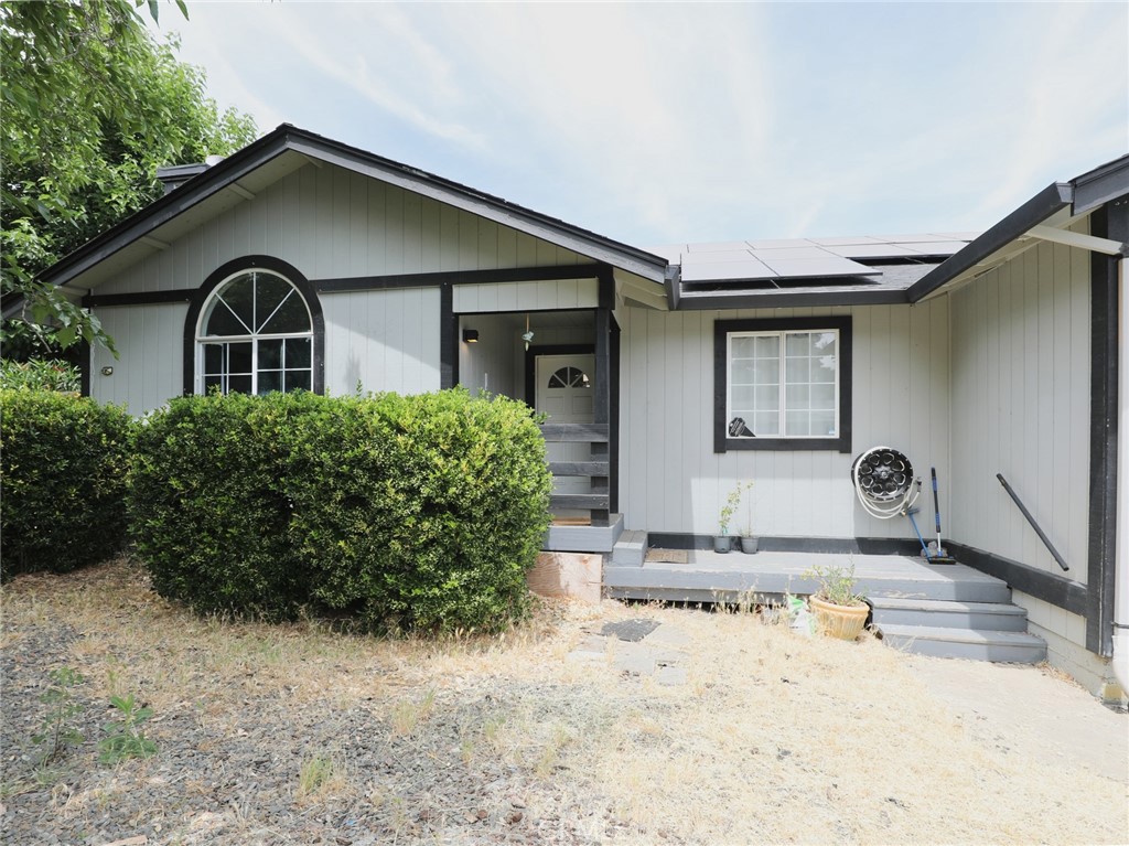 Charming renovated affordable three bedroom, two bath home with over 1400 sqft of living space, a two car garage, a new HVAC system and paid for Solar. Conveniently located on paved street near shopping and transportation. Laminate flooring throughout, tubs in both bathrooms updated kitchen with sliding door to deck for barbequing. Large fenced back yard with plenty of room for gardening and entertaining. Room for RV parking. This is a great home. Must come see!