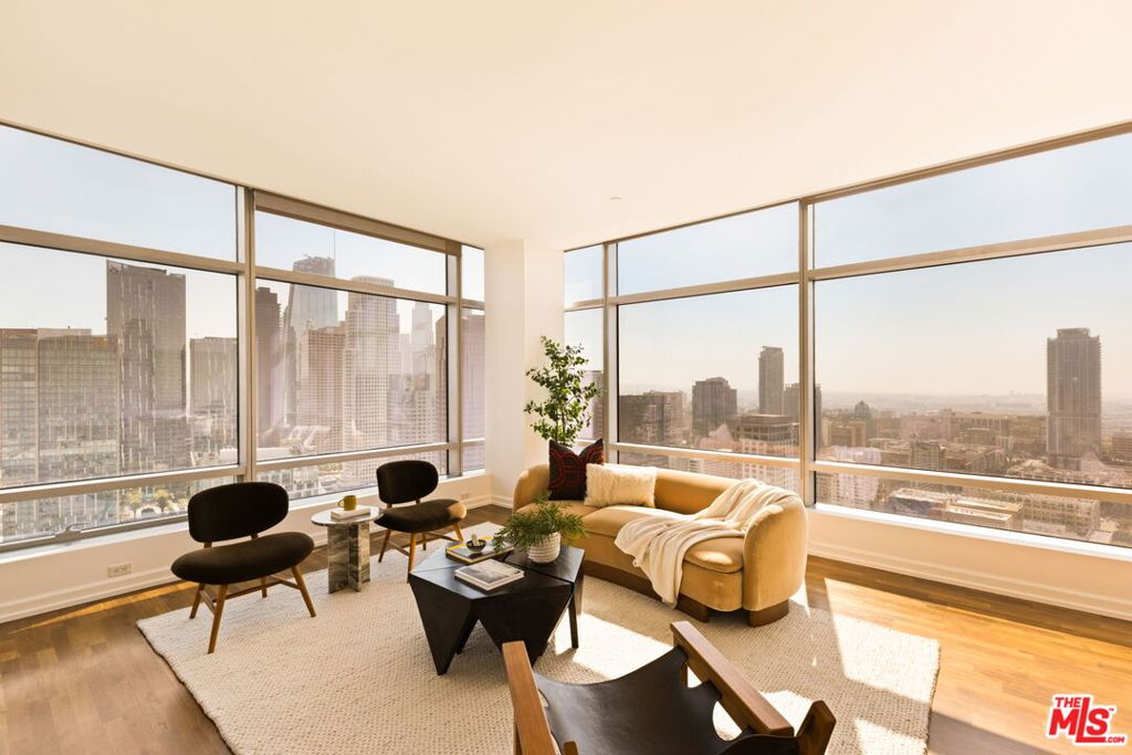 Soaring above the city on the 33rd floor of the iconic Ritz-Carlton Residences, this rare offering delivers elevated design, world-class service, and sweeping panoramic views of Los Angeles. Oversized picture windows frame the skyline and mountains beyond, creating a striking backdrop in every room. Ten-foot ceilings further enhance the open, airy feel, while the living and dining areas flow seamlessly for both everyday comfort and effortless entertaining. The chef's kitchen is as functional as it is beautiful, pairing sleek Snaidero Italian cabinetry with top-tier Gaggenau appliances. Two expansive bedroom suites serve as tranquil retreats, each with a spa-inspired ensuite bath. The primary suite features dual closets, a deep soaking tub, floor-to-ceiling tile, and a design that fills the space with natural light. The secondary suite is equally well-appointed. Life at the Ritz-Carlton includes legendary white-glove services such as housekeeping, in-residence dining, VIP event access, and exclusive hotel privileges worldwide - along with a private spa, resort-style pool, fitness center, and on-site dining. With two valet parking spaces, a private storage unit, and direct access to L.A. LIVE's sports, concerts, and restaurants, the best of the city is just an elevator ride away. For those who seek the pinnacle of luxury, convenience, and service, this is the address where it all comes together.***Can be sold with adjacent 33J for an opportunity to create a nearly 4K square foot corner masterpiece offering panoramic views.