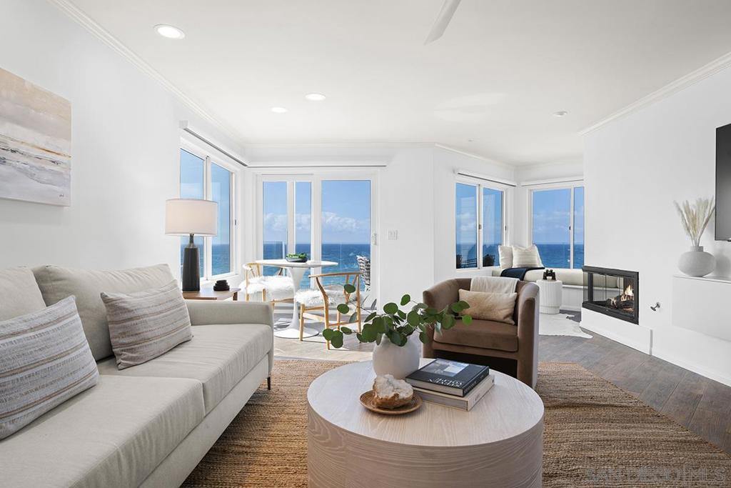 Ocean Front living at it's Finest! Endless panoramic Views! This beautifully remodeled oceanfront property offers the ultimate coastal retreat in Solana Beach. Thoughtfully designed and impeccably furnished, this stunning end-unit boasts unobstructed ocean views from a bright, open living space that seamlessly extends to a covered balcony. The all new European-style kitchen features high-end appliances, quartz countertops and a sleek wet bar with beverage fridge. Retreat to the luxurious primary suite where you can fall asleep and wake to the sound of the waves. Indulge in a spa-like experience with steam shower, jetted tub, motorized shades & more. Located in the exclusive Upscale Surfsong complex with ocean front pool, spa, Elevator access, clubhouse, tennis, pickle ball and gym. Walk to Fletcher Cove Beach Access & park, restaurants, cafes, fitness, train station, farmers market & Cedros Design District. Available long term or short term. Concierge Service & easy move in - Elevator access from 2 garage parking spaces, code entry lock, fully furnished & equipped, gated guest parking with EV chargers, housekeeping available, utilities, wifi connected and ready to enjoy. Lease includes Ting high speed fiber optic wifi, maintenance & repairs.