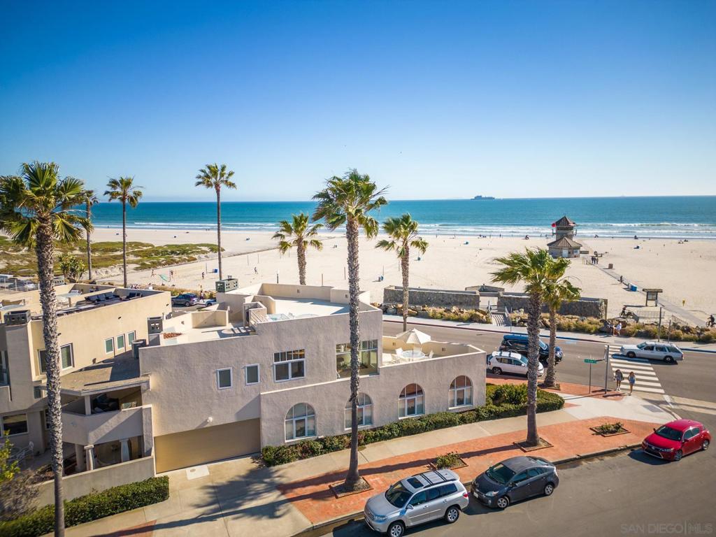 This stunning beachfront vacation home is waiting for your family to come relax and enjoy! Award-winning Coronado beach and the sparkling Pacific are right outside your front door! Three bedrooms, including master en-suite w/ private balcony, gourmet granite/stainless kitchen, 2 family rooms for relaxing and a study/library for quiet time. This reverse floor plan home features the kitchen, dining area and main living room on the second floor to fully showcase the spectacular ocean and beach views! The primary suite is also upstairs with a king size bed, private balcony, walk-in closet and flat screen TV. The en suite bath has a double vanity with a soaking tub, separate shower and double sink vanity. A comfortable and inviting family room downstairs has a large flat screen television, along with a library providing quiet space for working or relaxation. Two additional bedrooms (one w/ a queen bed and the other w/ 2 sets of twin bunk beds) share a hall bath. A laundry room and attached garage round out the downstairs space. This home includes an indoor fireplace, outdoor grill, beach gear and bikes for exploring, and is just a 5 minute walk to the Hotel Del Coronado. Beach equipment also provided. The view from the upper level living room and patio of this home is breath-taking. Spend some time on the rooftop deck, which showcases all of Coronado Beach, Point Loma, the Hotel Del Coronado, vistas of Downtown San Diego and the Coronado Bridge. This stunning beachfront vacation home is waiting for your family to come relax and enjoy! Award-winning Coronado beach and the sparkling Pacific are right outside your front door! Three bedrooms, including master en-suite with private balcony, a gourmet granite / stainless chef's kitchen, two family rooms for relaxing and a study/library for quiet time. Indoor fireplace, outdoor grill, beach gear and bikes for exploring all Coronado has to offer. This home away from home is just a 5 minute walk to the world famous Hotel Del Coronado, shopping, restaurants, boating, fishing, tennis, biking and more!! Bikes and beach equipment provided for your enjoyment. Enjoy all the outdoor activities Coronado and San Diego offers. On the island take in a game of golf at Coronado's bay front municipal golf course, ride the ferry to downtown San Diego, Little Italy, Gaslamp district and more! The San Diego Zoo and Sea World are a short 20 minute drive away. You will not want to go home! Sit back, relax and enjoy this amazing beach house on Coronado Island. Just steps to one of the best beaches in America, and three blocks down from the famous Hotel Del Coronado, you are in the best location in Coronado!!! The view from the upper level living room and patio of this home are breath-taking. Spend some time on the rooftop deck, which showcases all of Coronado Beach, Point Loma, the Hotel Del Coronado, Vistas of Downtown San Diego and the Coronado Bridge. The roof-top is especially fun on the 4th of July where you can take in 4-5 different firework displays all at once! A built-in BBQ, chaise loungers and Brown & Jordan Tables and Chairs provide for fun rooftop entertaining. The comfortable and inviting family room downstairs has a large flat screen TV and many movies to choose from. There is also a quiet library if you just want to close the french doors for a little peace and quiet. The upstairs master bedroom offers a king-size bed, walk-in-closet, built-in dressers, and a flat screen TV. The master bath is attached with his and her sinks and a full size glass enclosed shower. An outdoor, plush sitting area is located off of the master bedroom and offers views of San Diego. A second bedroom downstairs offers a queen-size bed with closet and dresser. The third bedroom is the 'bunk room' which offers four built-in twin bunk beds with a closet, built-in dresser and clothes drawers beneath the bunk beds.