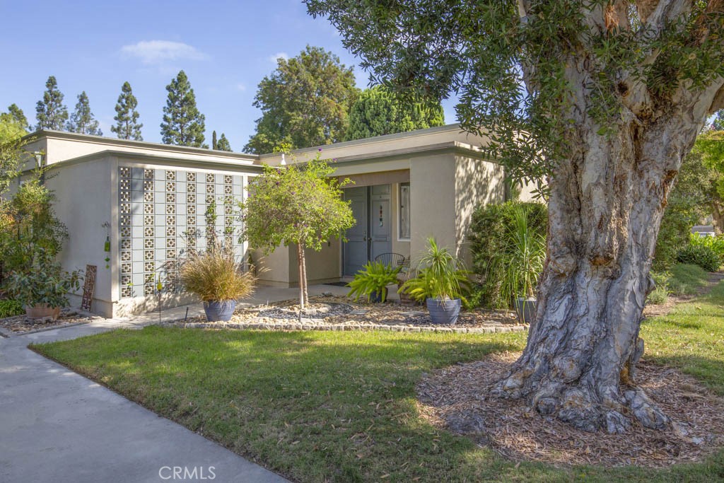 Welcome to 111-A Via Estrada – a lovely single-level, end-unit, two-bedroom, one-bath BARCELONA residence in the active Laguna Woods senior community. This property is located in a quiet corner of the cul-de-sac far from busy roads and noisy highways. Sitting on a bluff, this residence has a tranquil neighborhood view. The beautifully landscaped approach to the front of the residence adds to the property’s curb appeal. Private front patio is the perfect location for outdoor entertaining, dining and relaxing. The large living room allows a variety of different furniture configurations. The light and bright kitchen has a window overlooking the front patio. There is a private outdoor central atrium just off the dining area. The primary bedroom easily accommodates a king-size bed. The versatile guest bedroom could alternatively serve as a home office, workout room or arts and crafts studio. The bathroom has a skylight and a tub/shower combo with grab bar. Upgrades include gorgeous laminate flooring, dual-pane windows and a newer stackable LG washer/dryer conveniently located in a corner closet of the bathroom. This residence has been well-maintained and is move-in ready or it can be upgraded or completely remodeled to a new owner’s taste. The assigned carport has both upper and lower storage cabinets. Plus, there is ample guest parking in the cul-de-sac. Do not miss this attractive residence!